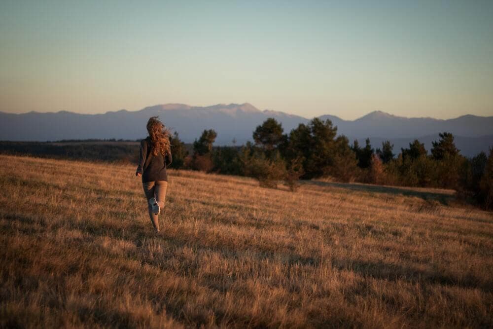 a person walking in a field