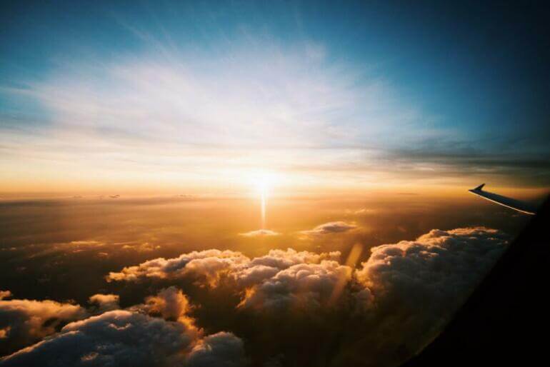 aerial view of sea of clouds during sunset