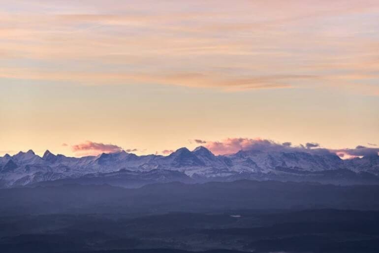 a view of a mountain range at sunset